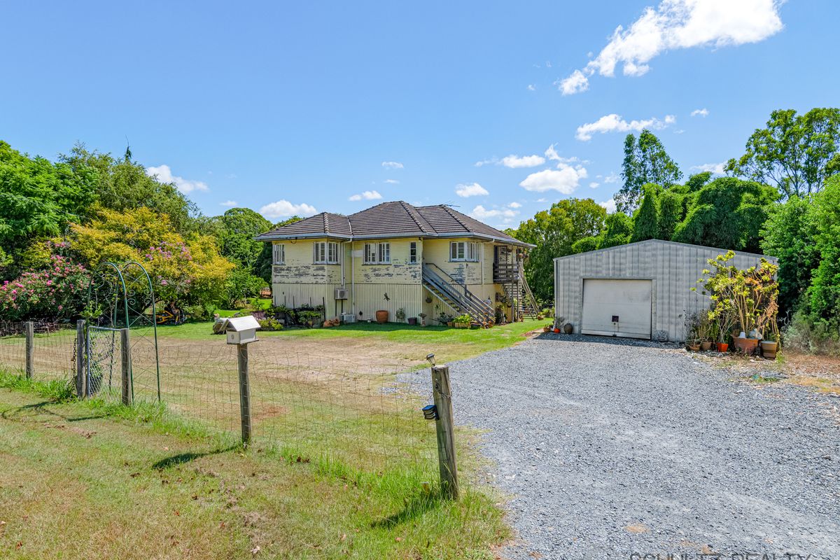 Invest or renovate.  One acre flat block with 3 bedroom character home with a study or 4th bedroom and a huge shed