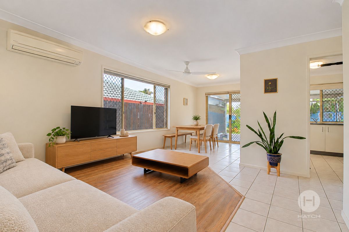 Bright Three-Bedroom Home with Covered Deck and Established Gardens