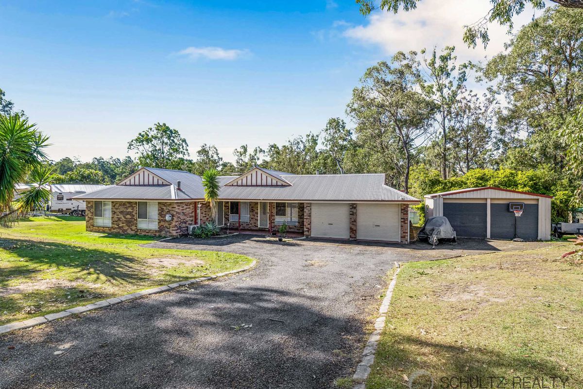 Don’t miss this dual living acreage opportunity! 4 bed house plus 2 bedroom granny flat and powered shed in Greenbank!