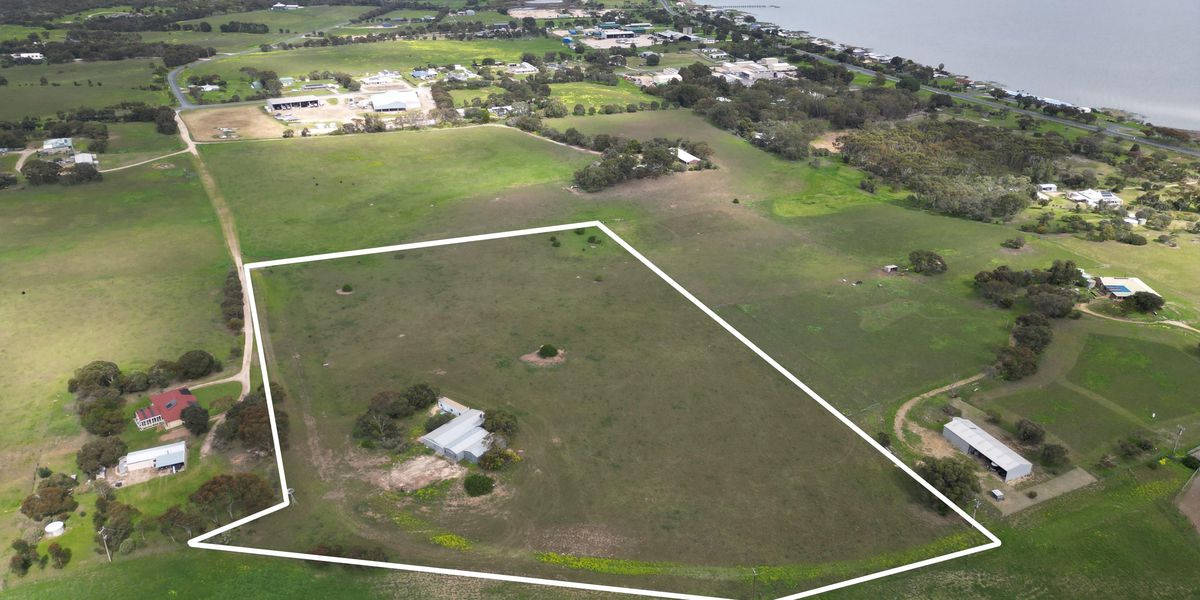 11.87 acres of lifestyle freedom with extensive shedding